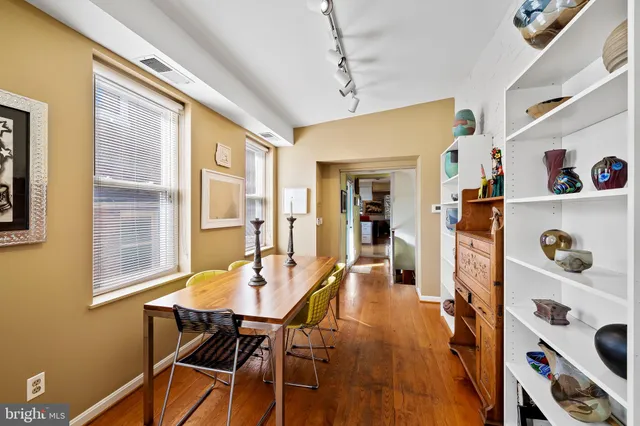 a view of a dining room with furniture and a window