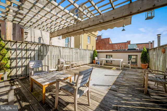 a view of a patio with couches table and chairs