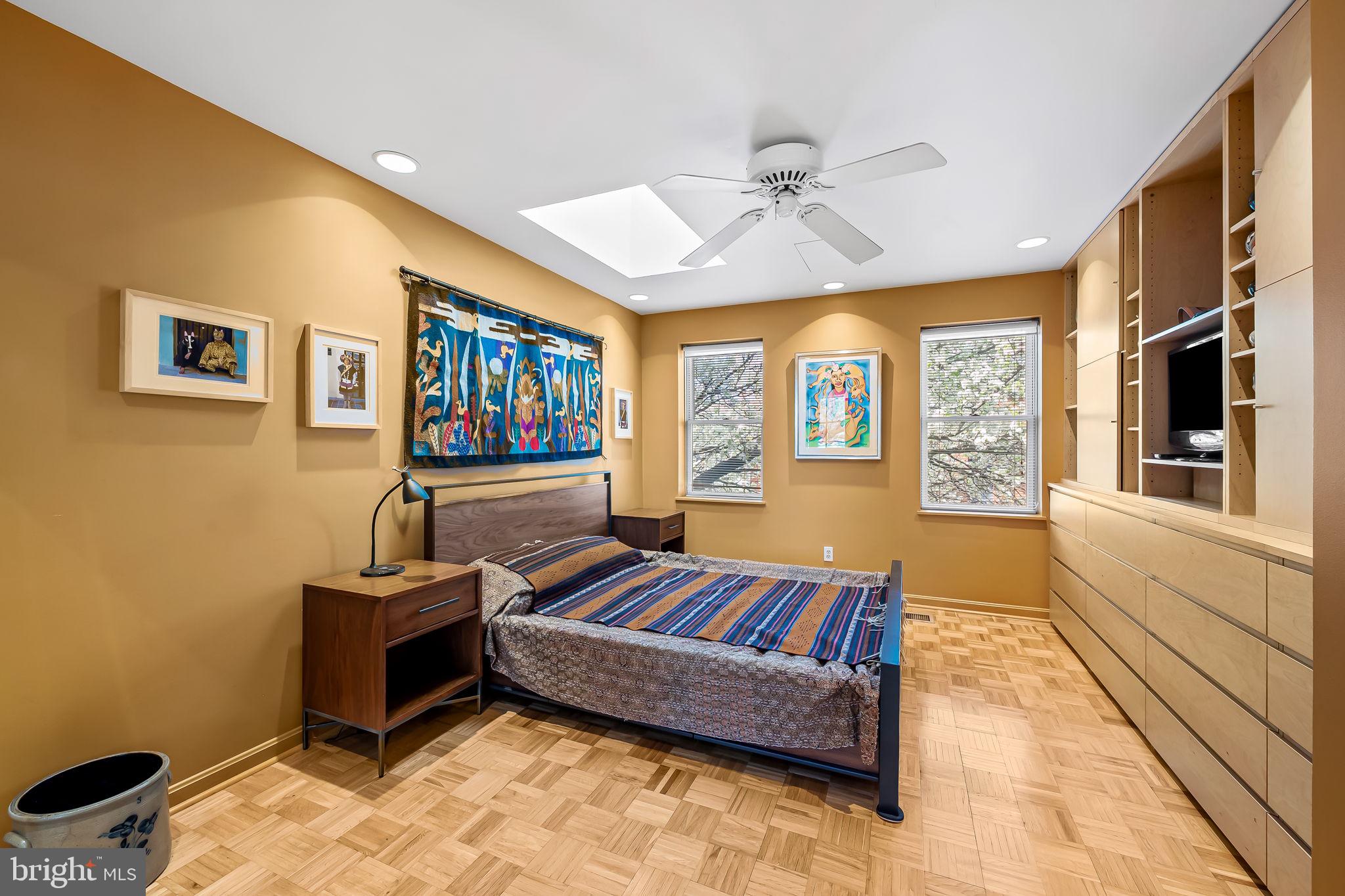 1637 East Baltimore Street Baltimore, MD 21231 - Photo 32 of 39 a bedroom with furniture and a large window