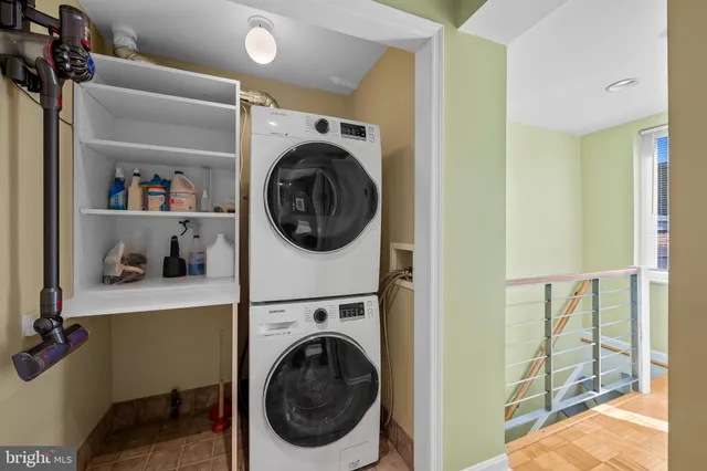 a view of a hallway with washer and dryer