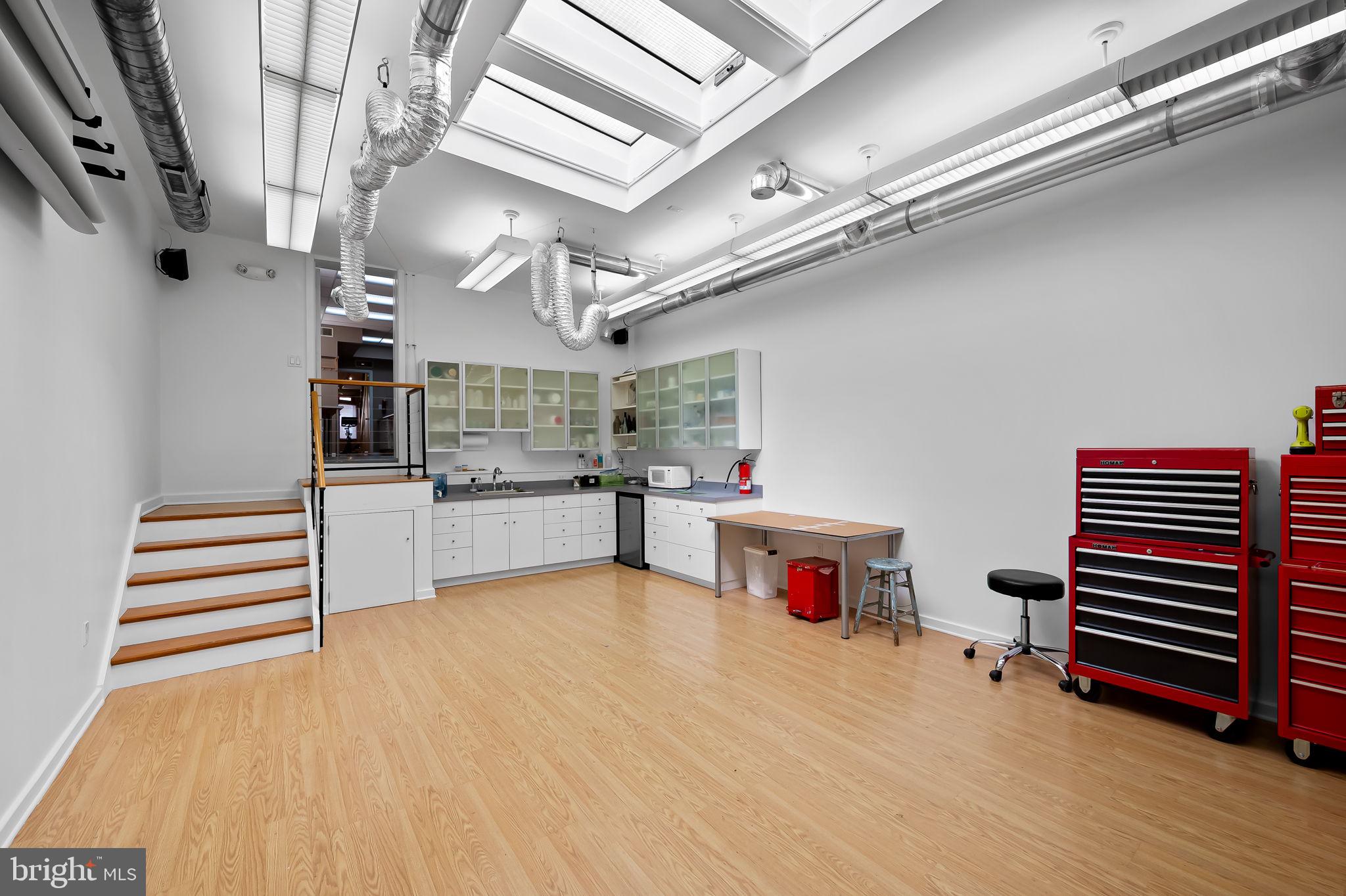 1637 East Baltimore Street Baltimore, MD 21231 - Photo 9 of 39 a storage and utility room with lots of wooden furniture