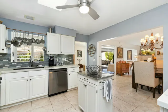 a kitchen with stainless steel appliances a refrigerator stove microwave and cabinets