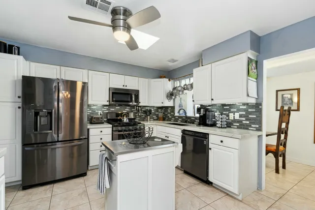 a view of a dining room with furniture and window