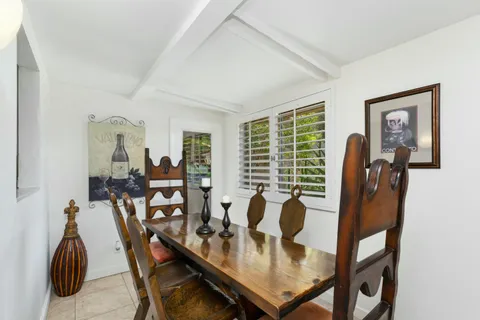 a view of a livingroom with furniture and a window