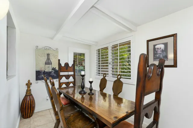a view of a livingroom with furniture and a window