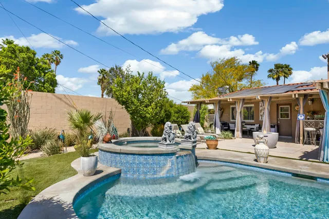 a view of a swimming pool with a patio