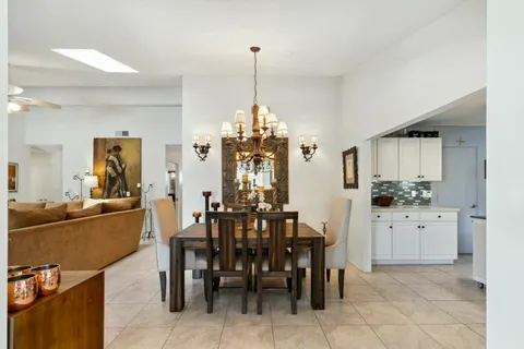 a very nice looking dining room with a table and chairs