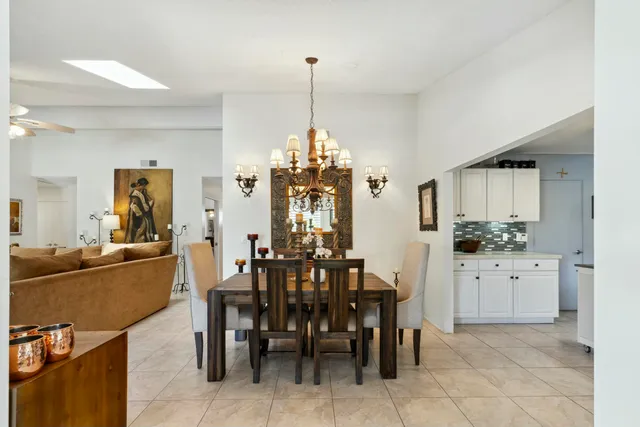 a very nice looking dining room with a table and chairs