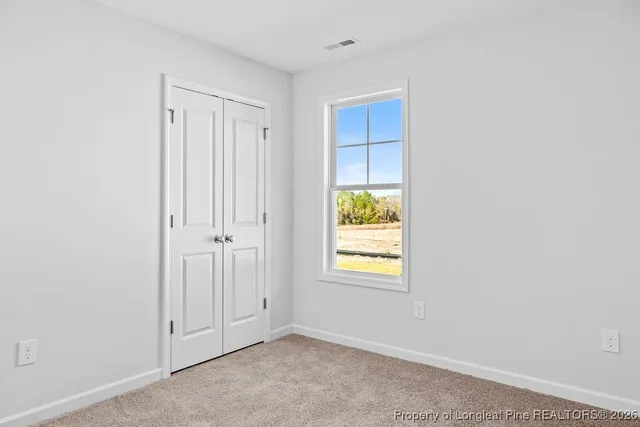 a white toilet sitting next to a shower