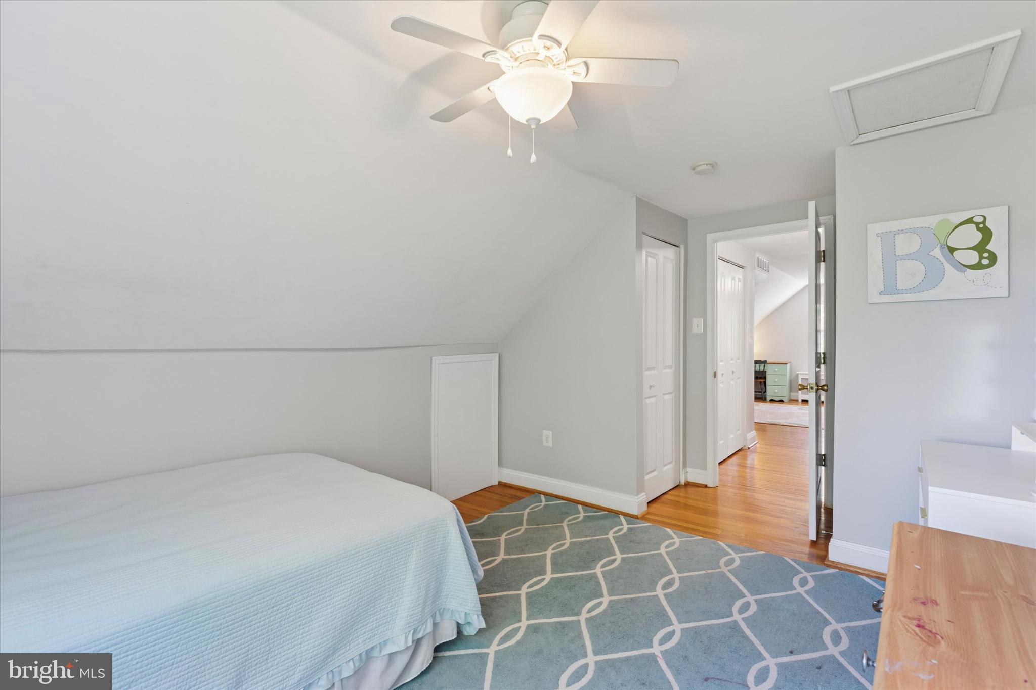 510 Concord Road Broomall, PA 19008 - Photo 25 of 35 a bedroom with a bed and a chandelier