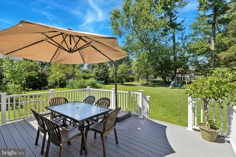 a view of a table and chairs on the roof deck