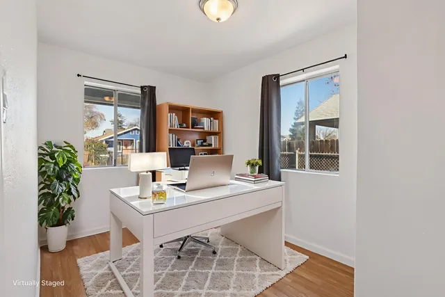 a workspace with furniture and window