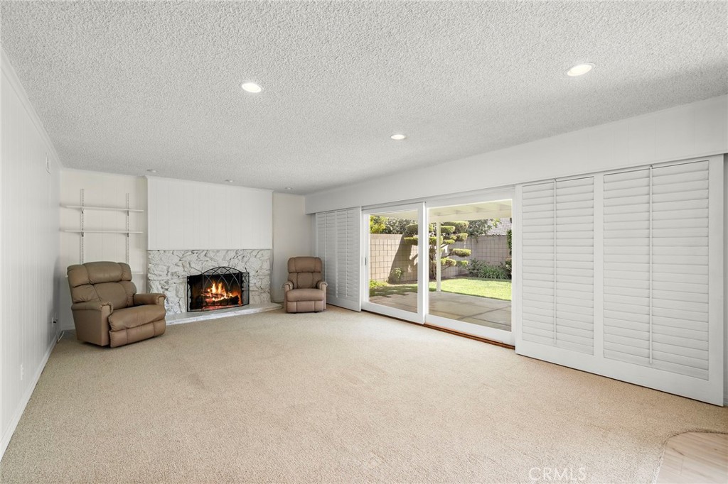 10202 Meredith Drive Huntington Beach, CA 92646 - Photo 7 of 13 Family room with fireplace