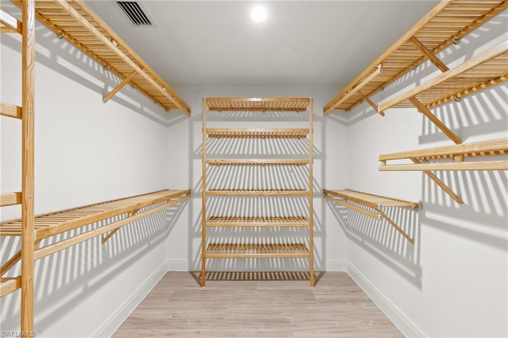 2178 Pinewoods Circle, Unit 25 Naples, FL 34105 - Photo 24 of 45 a view of staircase with white walls and a window