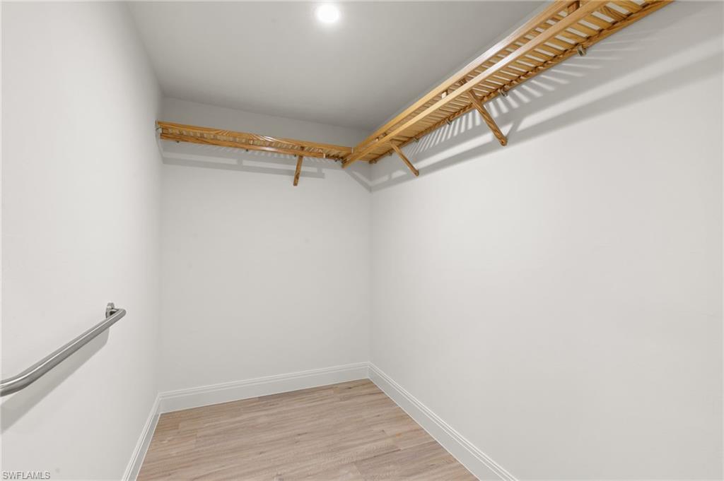 2178 Pinewoods Circle, Unit 25 Naples, FL 34105 - Photo 25 of 45 a view of a room with racks on the wall