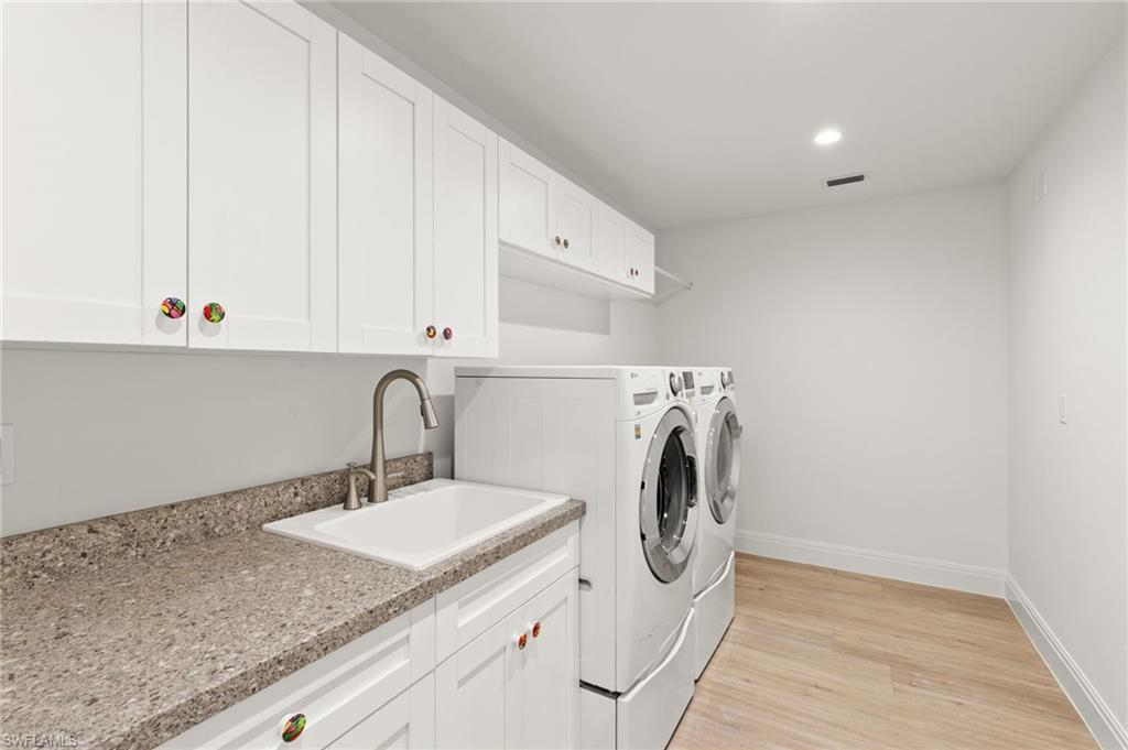 2178 Pinewoods Circle, Unit 25 Naples, FL 34105 - Photo 31 of 45 a utility room with dryer and washer
