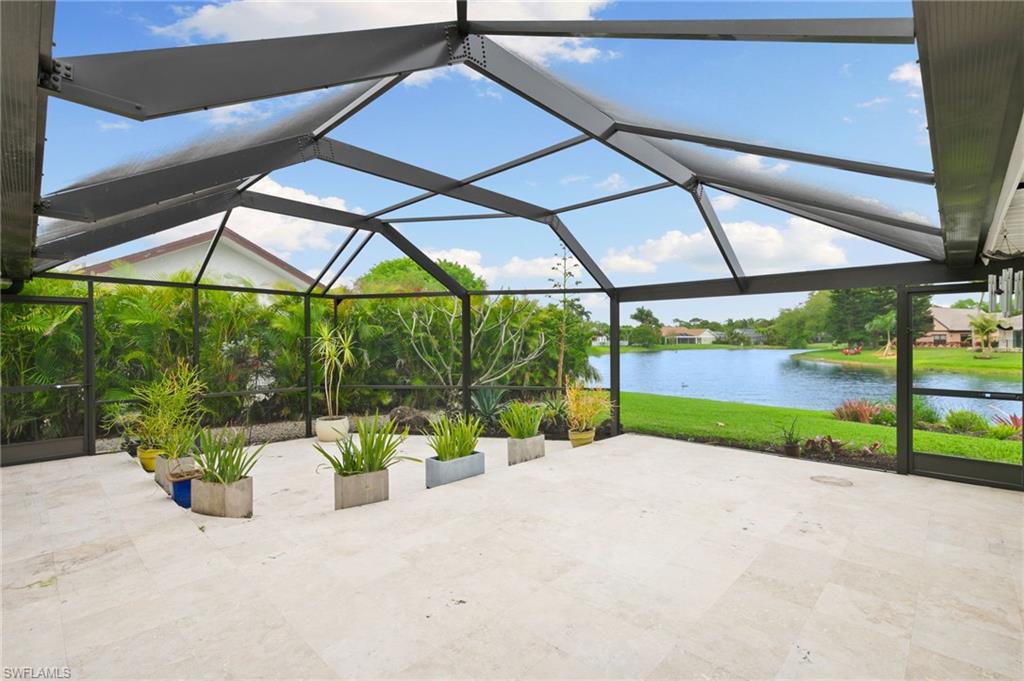 2178 Pinewoods Circle, Unit 25 Naples, FL 34105 - Photo 32 of 45 a view of a backyard with porch and garden