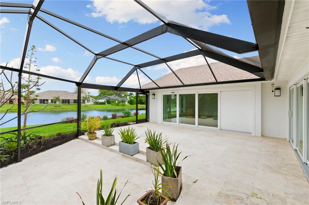 2178 Pinewoods Circle, Unit 25 Naples, FL 34105 - Photo 34 of 45 a house view with a garden space