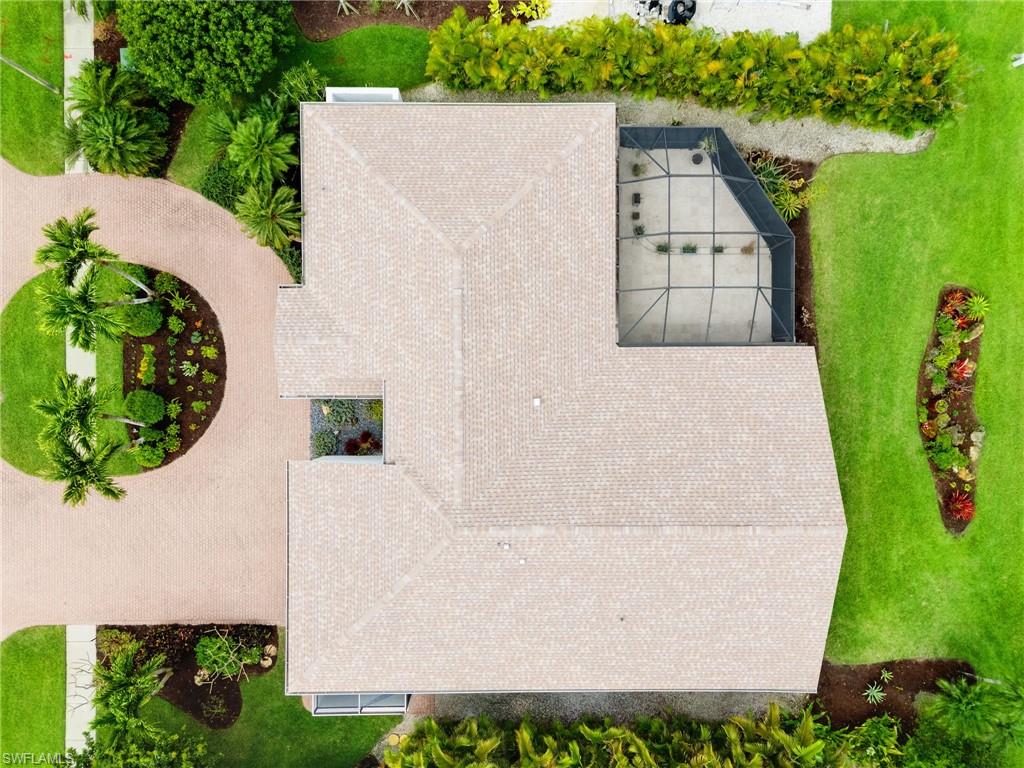 2178 Pinewoods Circle, Unit 25 Naples, FL 34105 - Photo 38 of 45 an aerial view of a house having yard