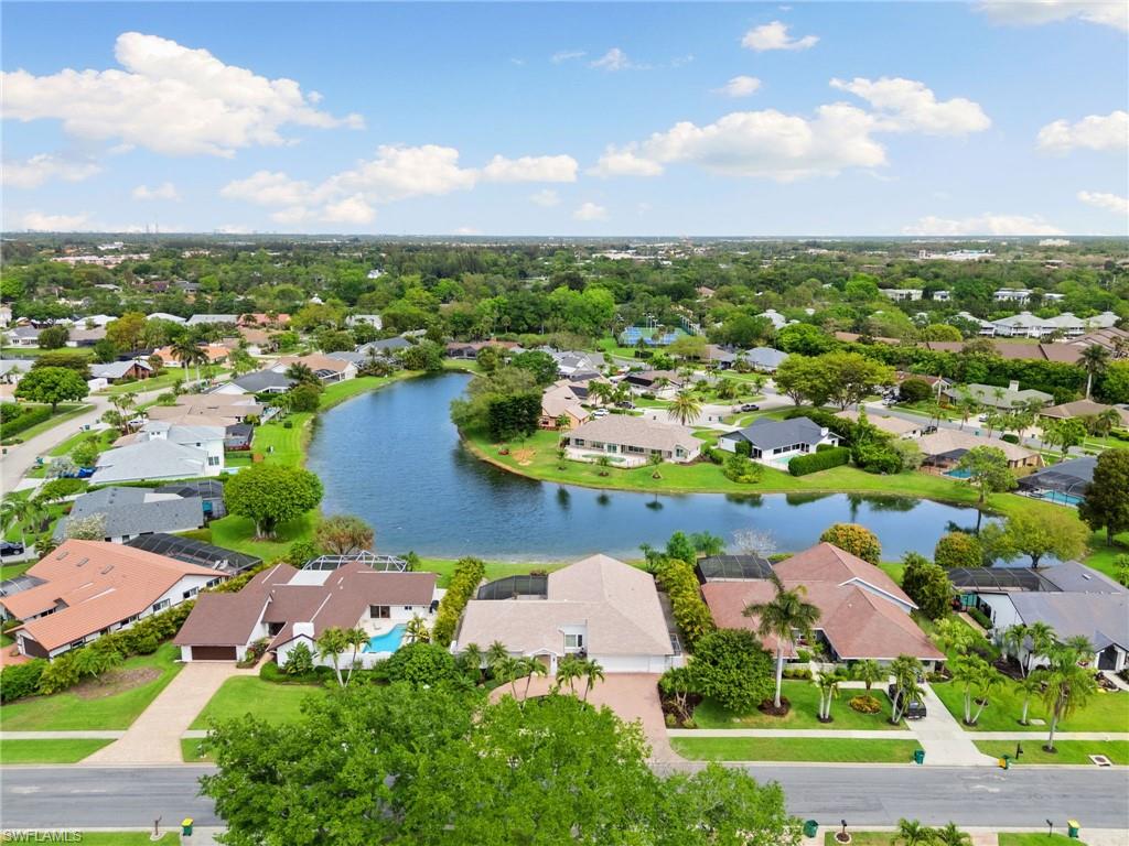 2178 Pinewoods Circle, Unit 25 Naples, FL 34105 - Photo 43 of 45 an aerial view of residential houses with outdoor space and swimming pool