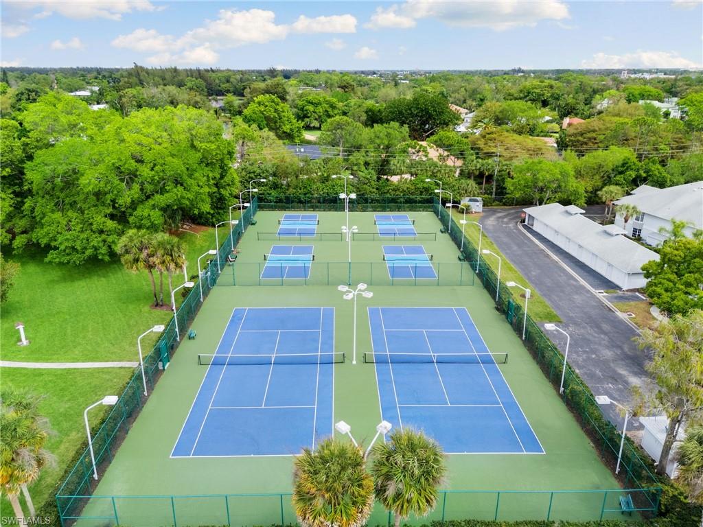 2178 Pinewoods Circle, Unit 25 Naples, FL 34105 - Photo 45 of 45 a view of yard with swimming pool
