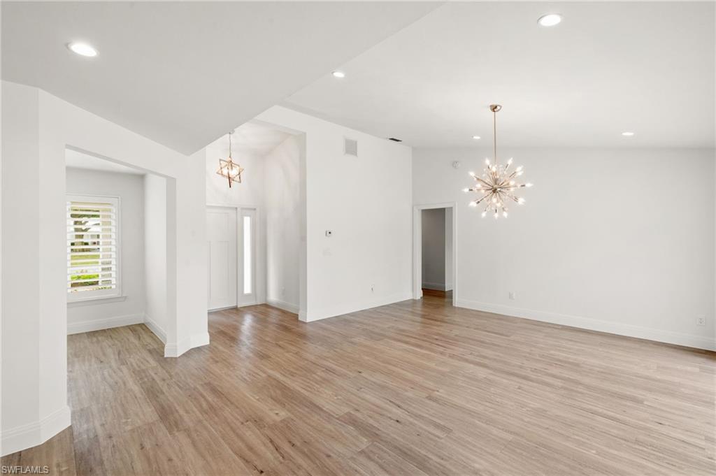 2178 Pinewoods Circle, Unit 25 Naples, FL 34105 - Photo 9 of 45 a view of a livingroom with wooden floor
