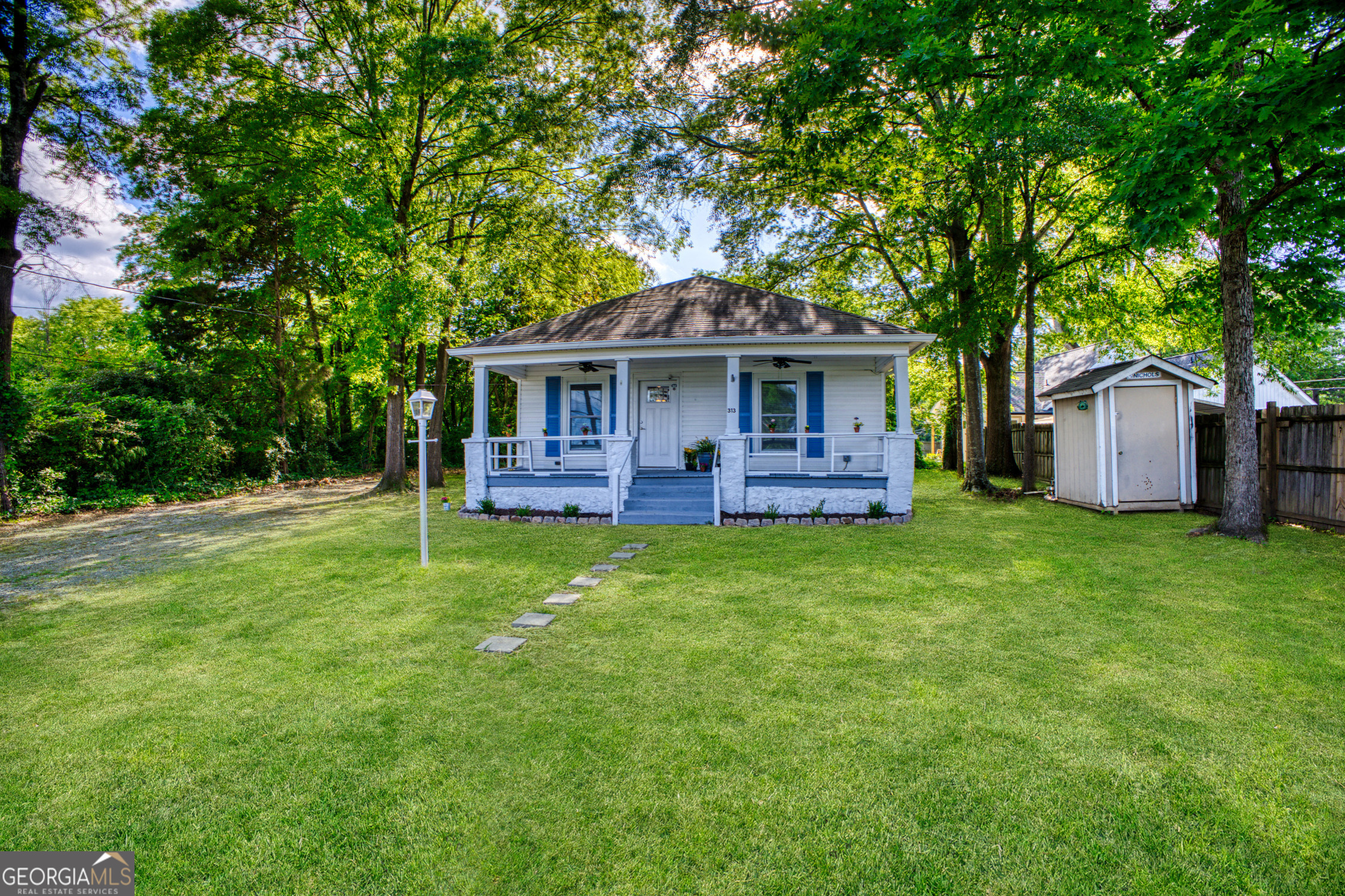 313 Moore Street Rome, GA 30165 - Photo 1 of 1 a front view of house with yard and green space
