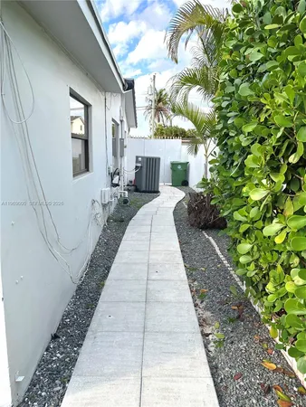 a house with trees in front of it