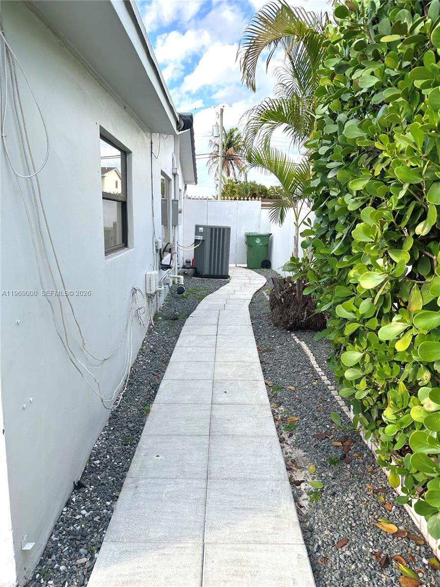 1960 West 63rd Street, Unit EFFICIENCY Hialeah, FL 33012 - Photo 11 of 12 a house with trees in front of it