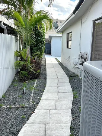 a view of backyard with potted plants