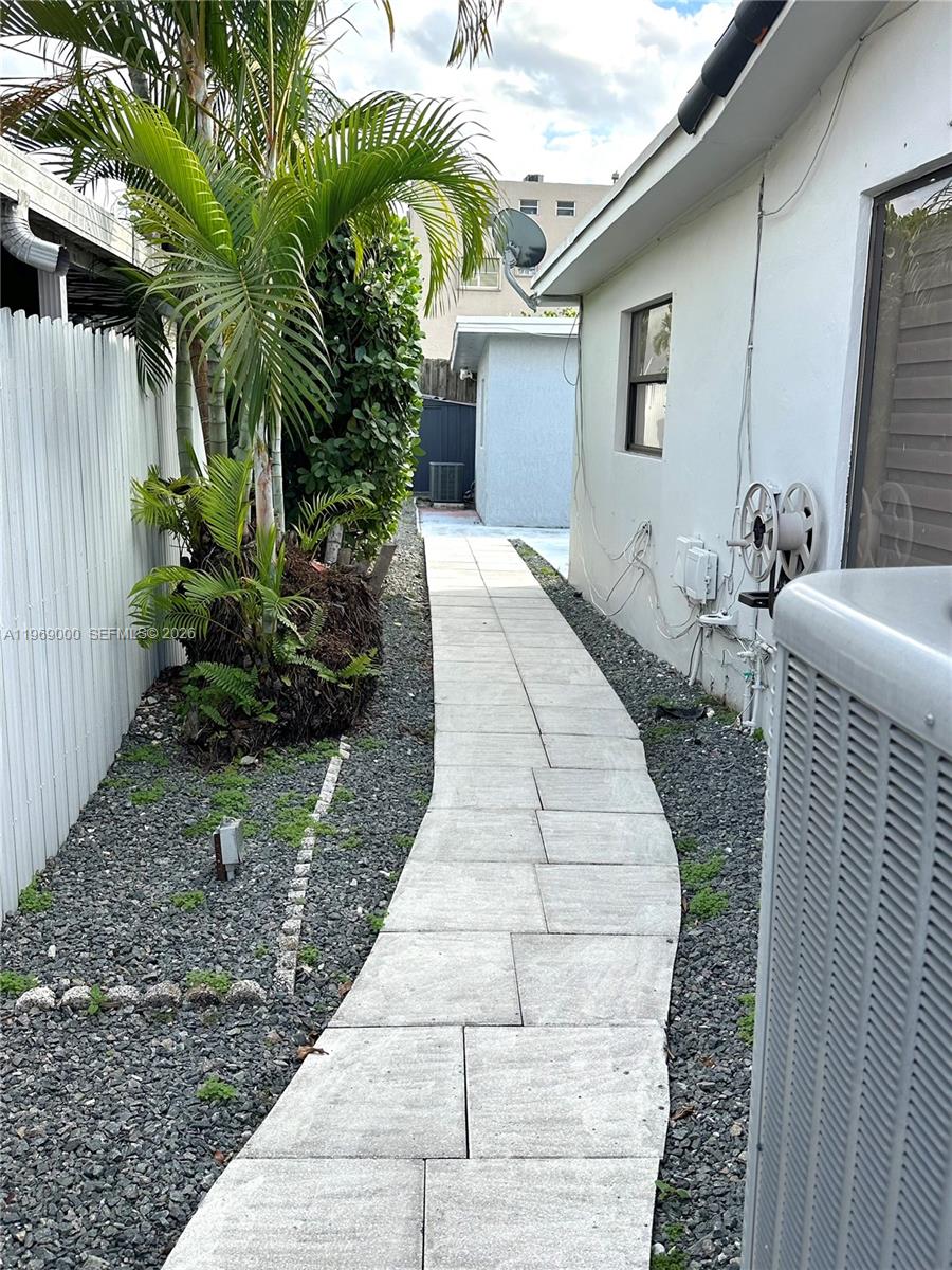 1960 West 63rd Street, Unit EFFICIENCY Hialeah, FL 33012 - Photo 12 of 12 a view of backyard with potted plants
