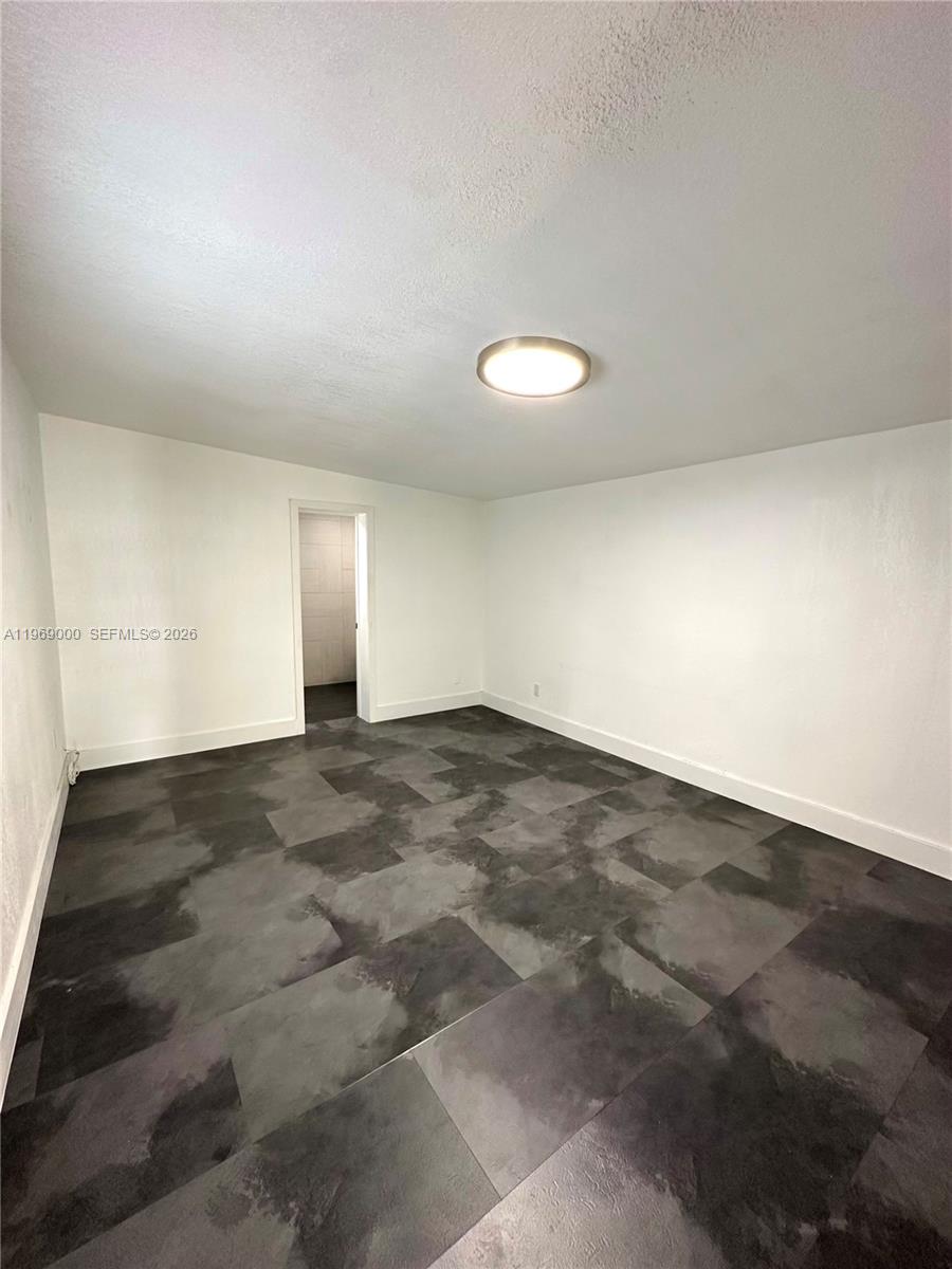 1960 West 63rd Street, Unit EFFICIENCY Hialeah, FL 33012 - Photo 7 of 12 a view of empty room
