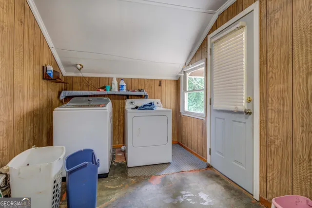 a utility room with dryer and washer