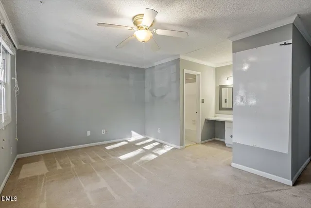 a view of empty room with a bathroom