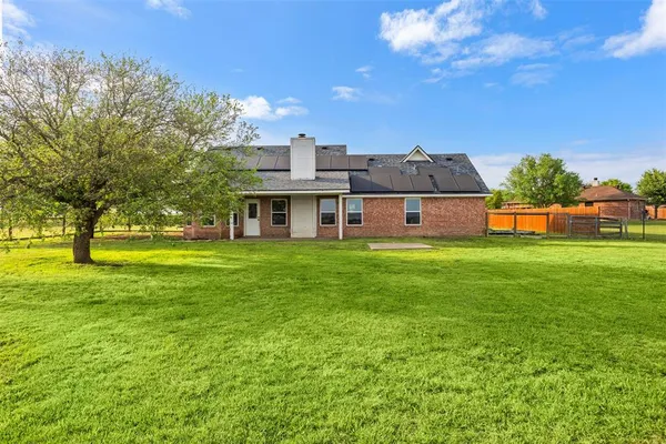 a view of a house with a big yard
