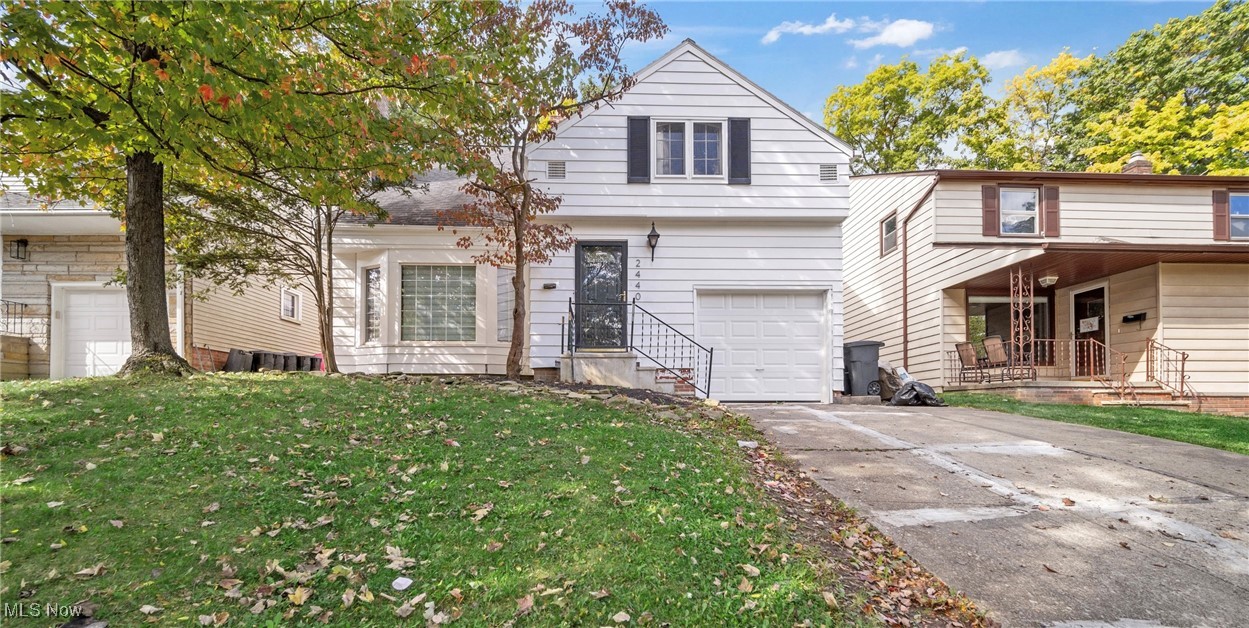 2440 White Road Cleveland, OH 44118 - Photo 1 of 43 View of front of house with a garage and a front lawn