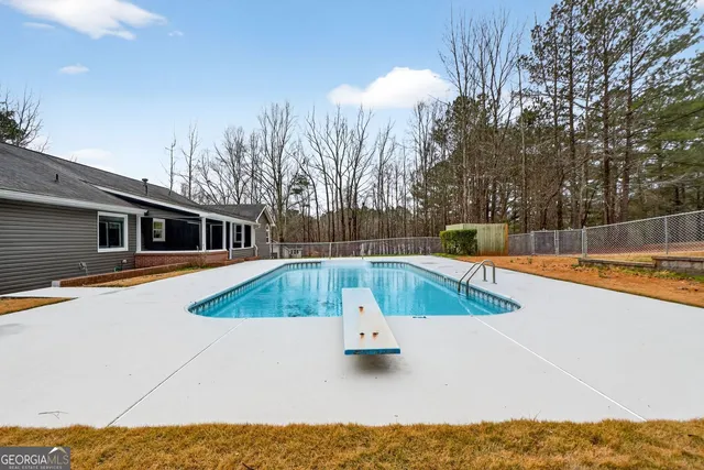 front view of a house with a swimming pool