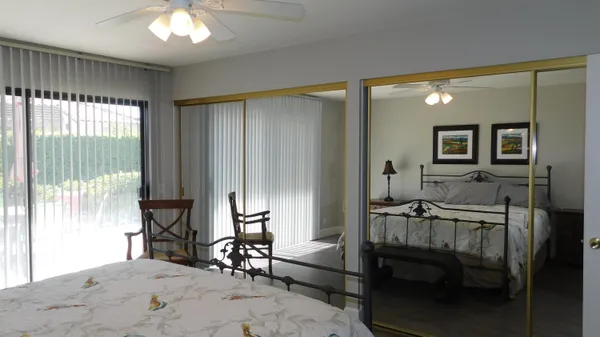 a bedroom with furniture and a window