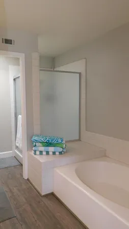 a white bath tub sitting in a bathroom