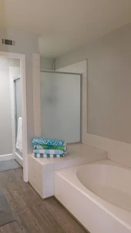 a white bath tub sitting in a bathroom