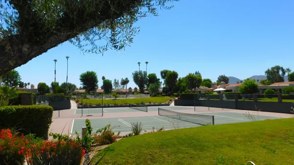 a view of a garden with houses