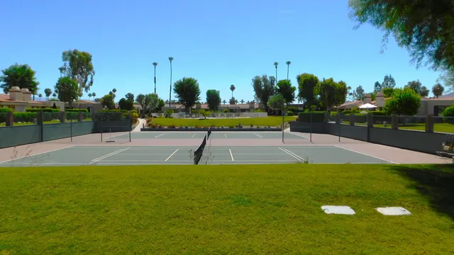a view of a swimming pool with an outdoor space and seating area
