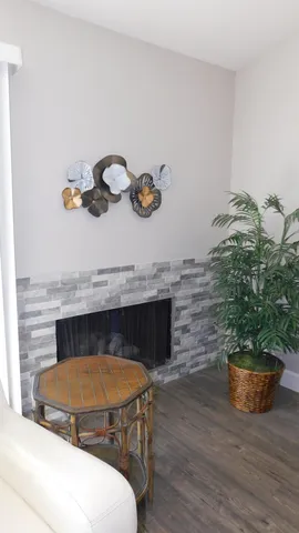 a room with furniture and a potted plant