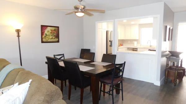 a view of a dining room with furniture window and wooden floor