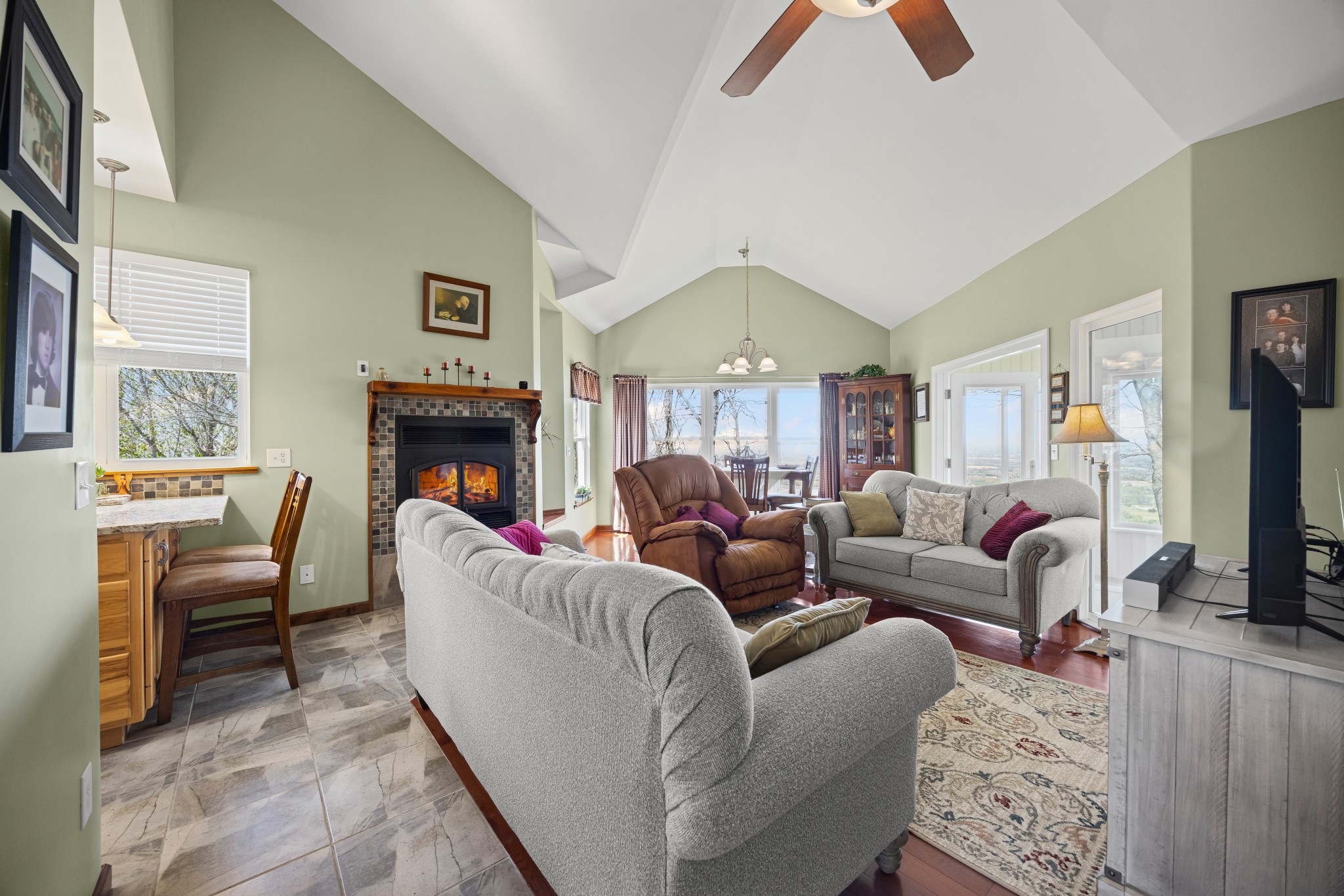 300 Iron Gap Road Belvidere, TN 37306 - Photo 14 of 84 a living room with furniture a fireplace and a flat screen tv