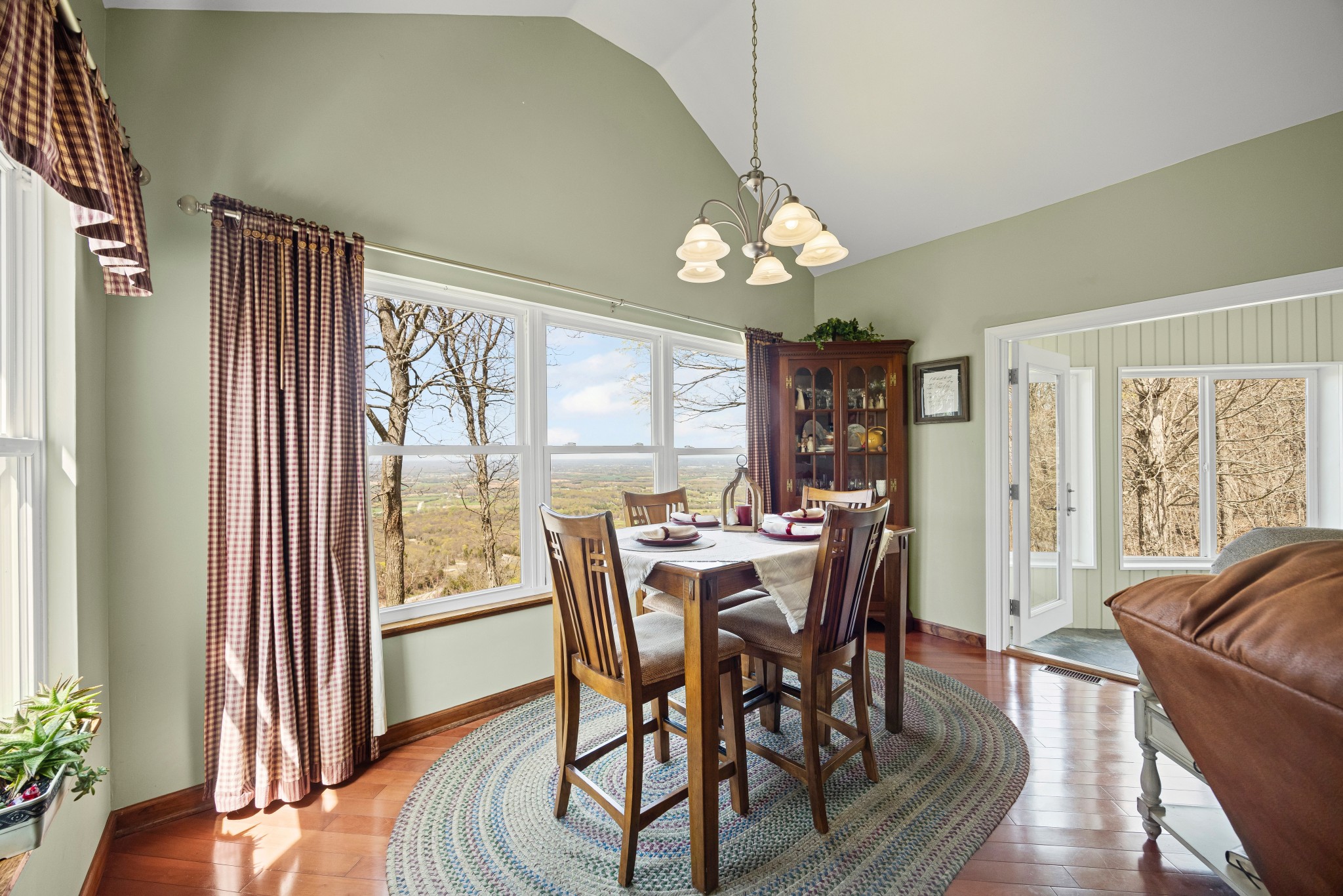 300 Iron Gap Road Belvidere, TN 37306 - Photo 16 of 84 a view of a dining room with furniture wooden floor and chandelier