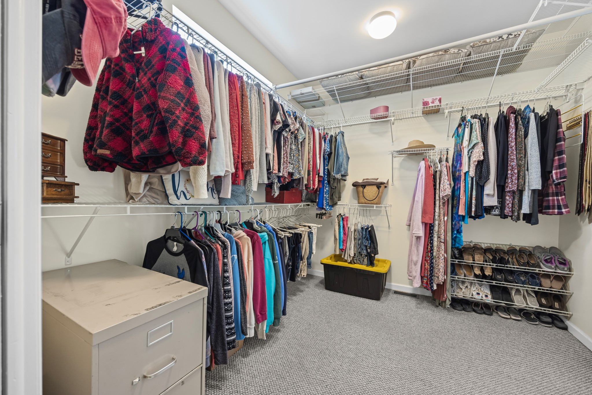 300 Iron Gap Road Belvidere, TN 37306 - Photo 29 of 84 a view of walk in closet with clothes and shoes
