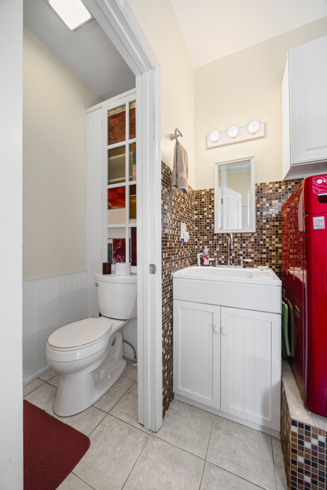 300 Iron Gap Road Belvidere, TN 37306 - Photo 32 of 84 a bathroom with a toilet a sink and a window