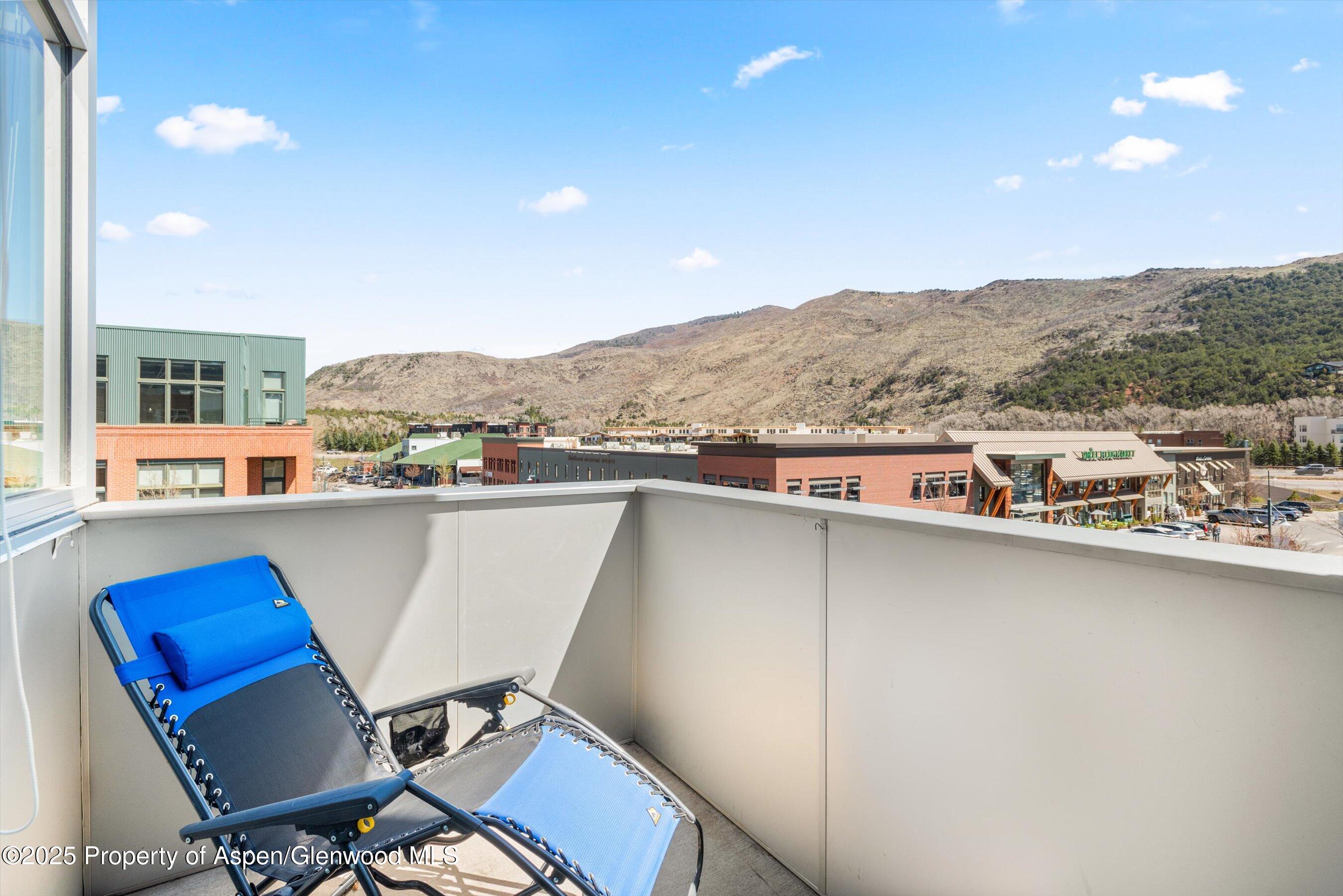361 Robinson Street, Unit 314 Basalt, CO 81621 - Photo 8 of 17 a view of a chairs and table in a terrace