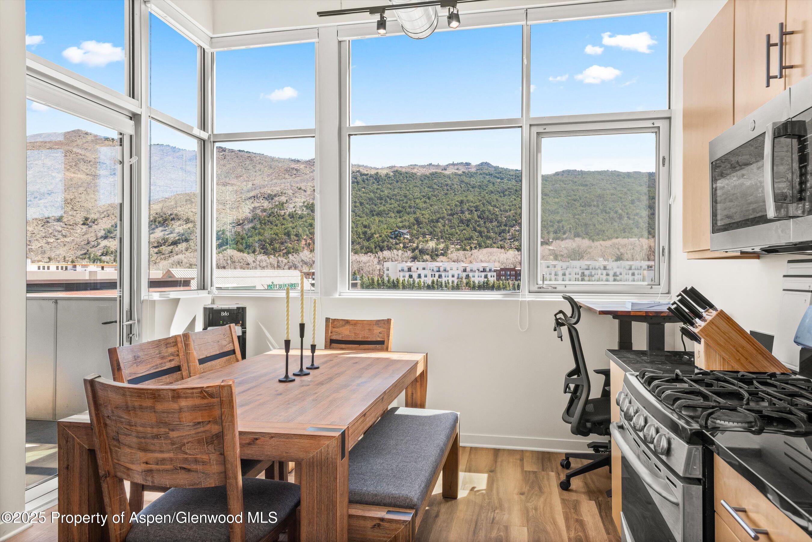 361 Robinson Street, Unit 314 Basalt, CO 81621 - Photo 9 of 17 a view of a dining room with furniture window and outside view